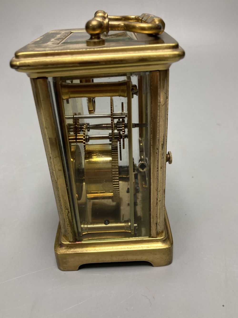 A gilt-brass carriage timepiece, with white enamelled Roman dial and outer travelling case and another carriage clock (2)